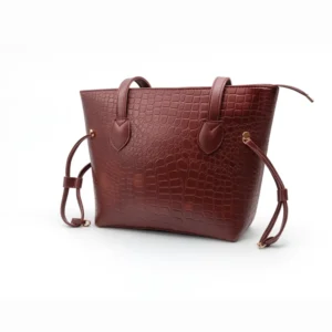 Burgundy Croc Textured Tote Bag at Nouvaid Center. Luxurious burgundy faux leather with embossed crocodile texture, spacious, and perfect for everyday use