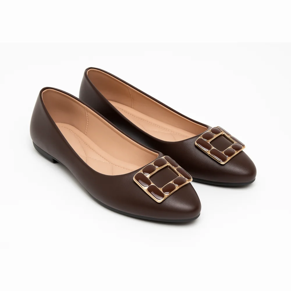 Sophisticated women’s flats in a rich mocha brown shade, featuring a bold square buckle detail with gold trim for a polished and timeless look. Designed for versatility and elegance.