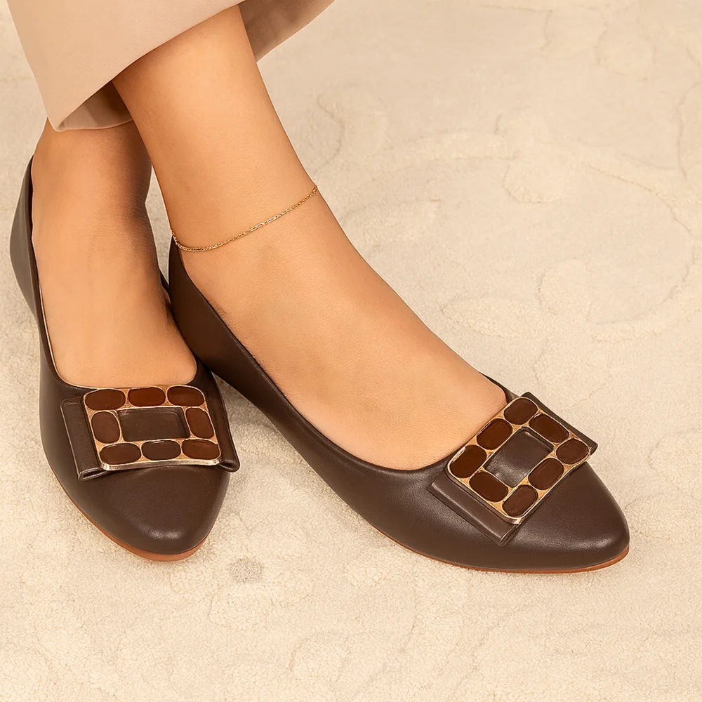 Sophisticated women’s flats in a rich mocha brown shade, featuring a bold square buckle detail with gold trim for a polished and timeless look. Designed for versatility and elegance.