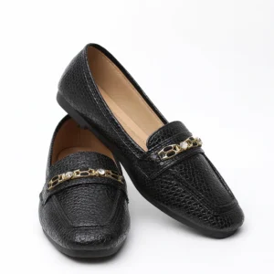 Sophisticated and versatile, Midnight Luxe is a chic ladies’ loafer designed for both formal and casual wear. Its textured black finish and metallic detail add a modern edge while keeping the look elegant.