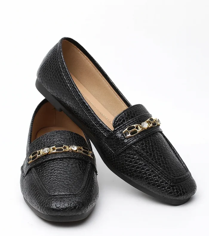 Sophisticated and versatile, Midnight Luxe is a chic ladies’ loafer designed for both formal and casual wear. Its textured black finish and metallic detail add a modern edge while keeping the look elegant.