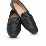 Sophisticated and versatile, Midnight Luxe is a chic ladies’ loafer designed for both formal and casual wear. Its textured black finish and metallic detail add a modern edge while keeping the look elegant.