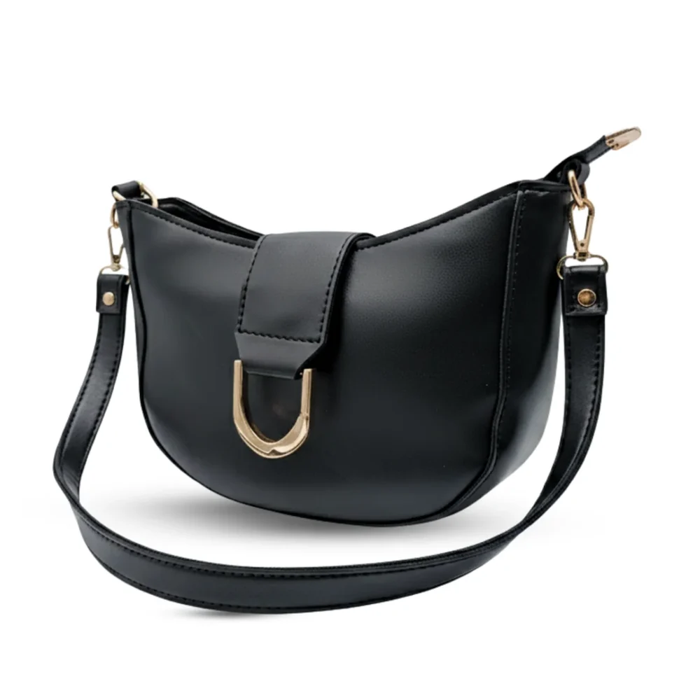 Black half-moon hobo bag with a large gold U-shaped buckle and a chunky gold link chain strap.