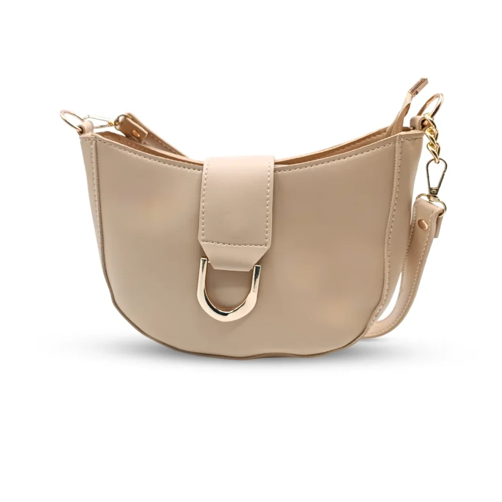 Beige half-moon hobo bag with a large gold U-shaped buckle and a chunky gold link chain strap.
