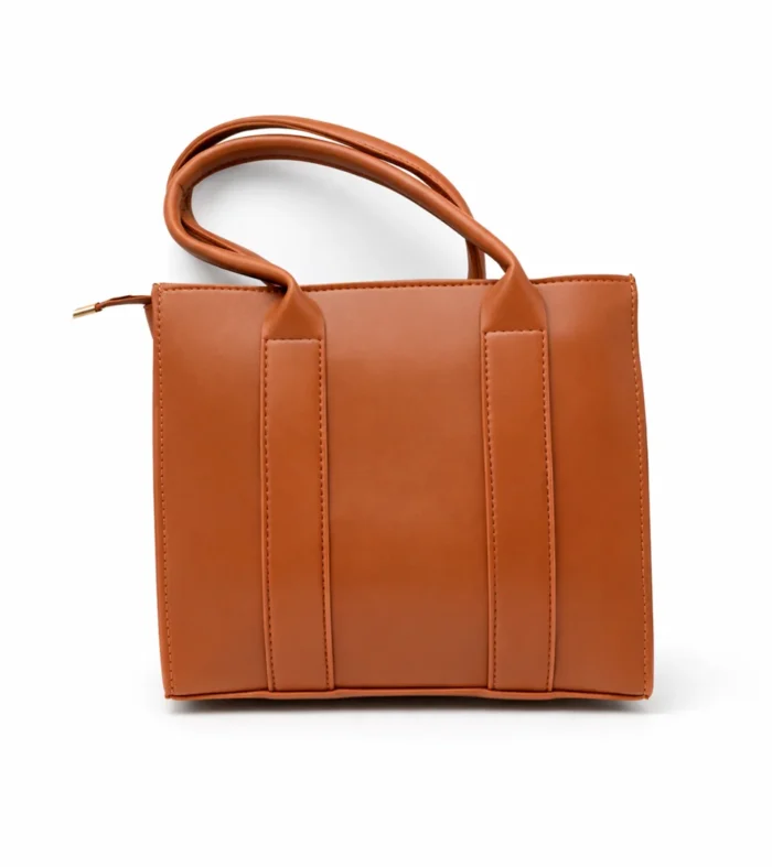 Structured tan vegan leather square tote bag with long shoulder handles and a minimalist smooth finish