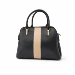 Structured black pebble-grain satchel bag with a vertical cream stripe in the center and gold handles.
