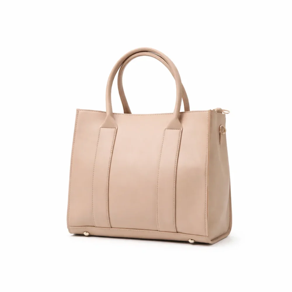 Structured nude beige vegan leather square tote bag with long handles and a minimalist smooth finish.