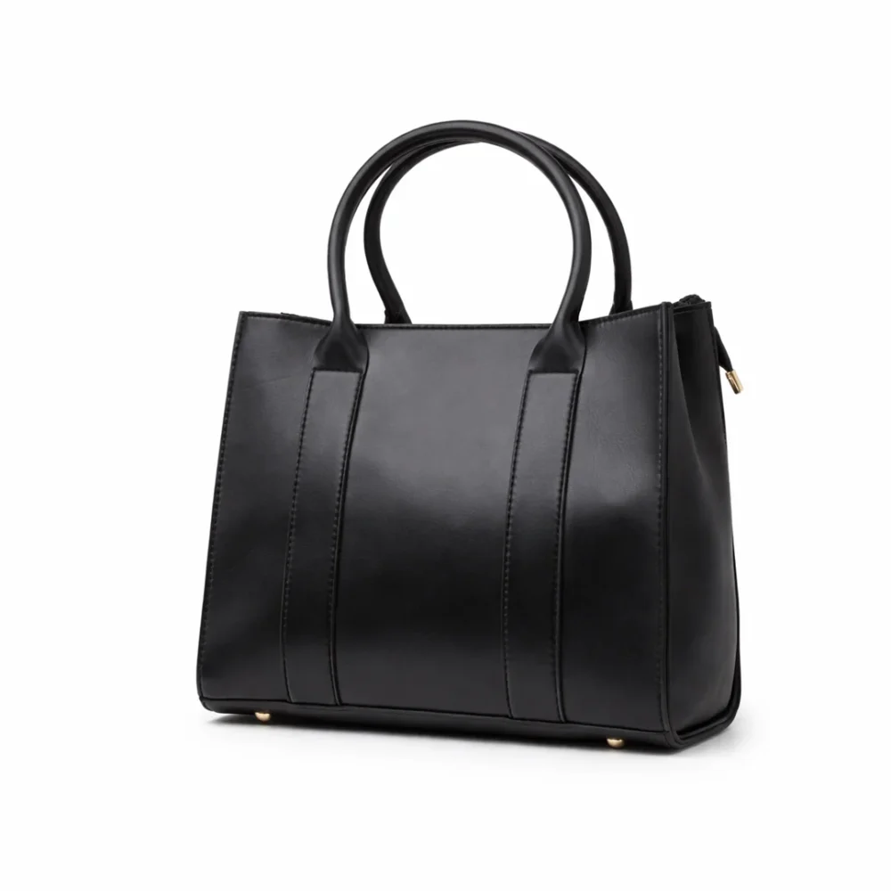 Structured Obsidian Black leather square tote bag with long handles and a minimalist smooth finish.