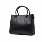 Structured Obsidian Black leather square tote bag with long handles and a minimalist smooth finish.
